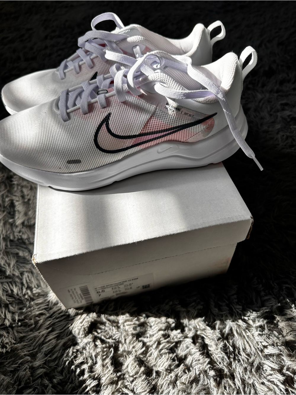 Nike White Sneakers with Black Swoosh and Pink Accent